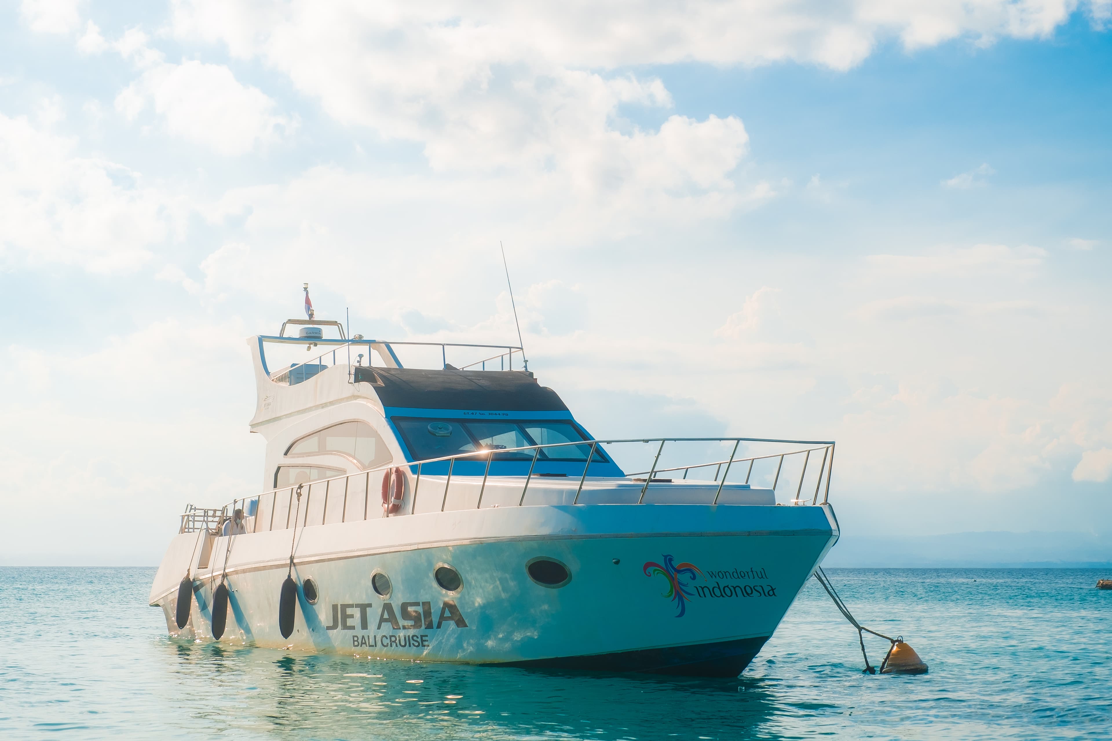 Aerial view of the Jet Asia luxury yacht cruising Bali's waters
