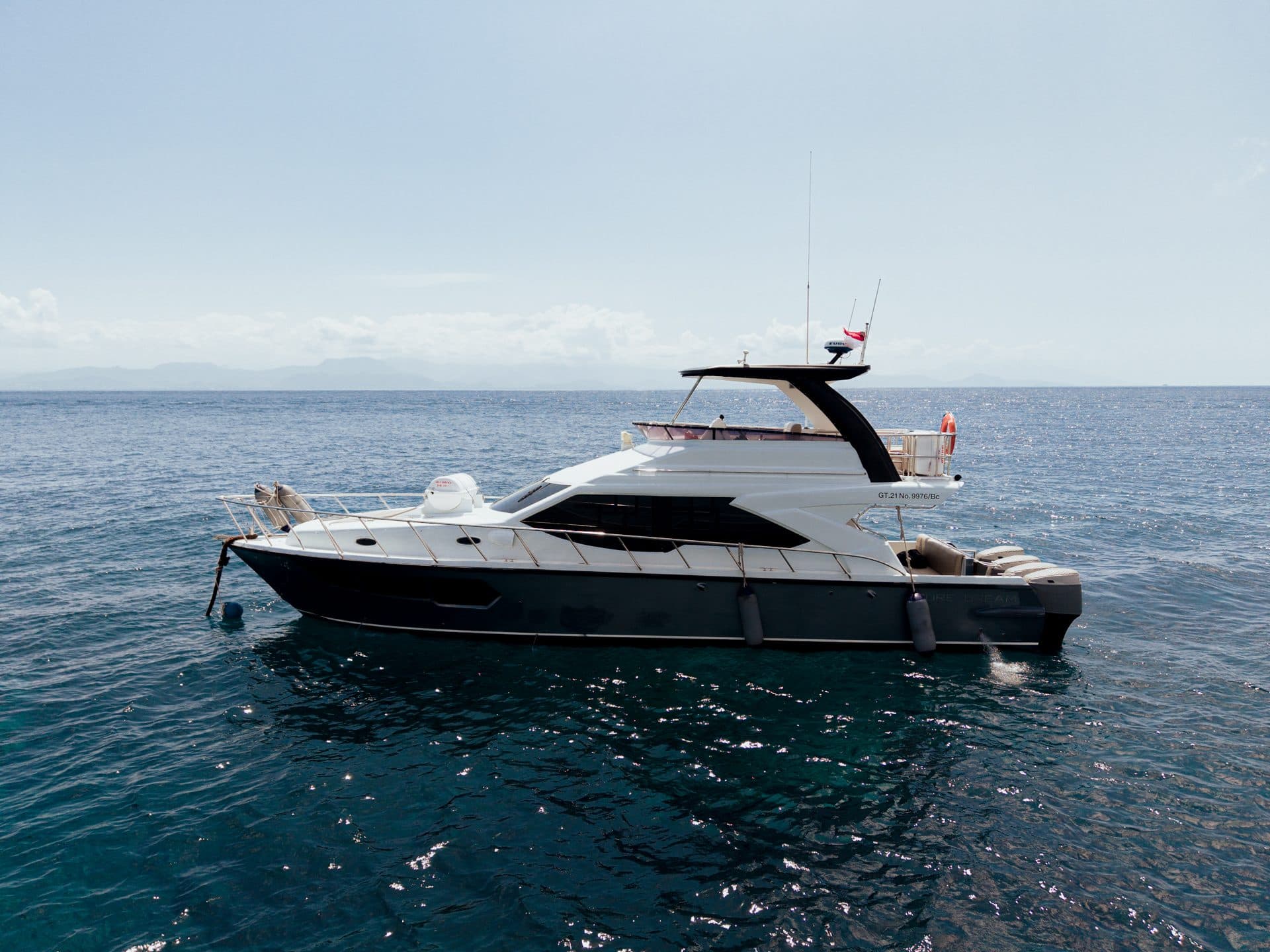 Aerial drone view of the Azure Dream yacht off the Bali coast