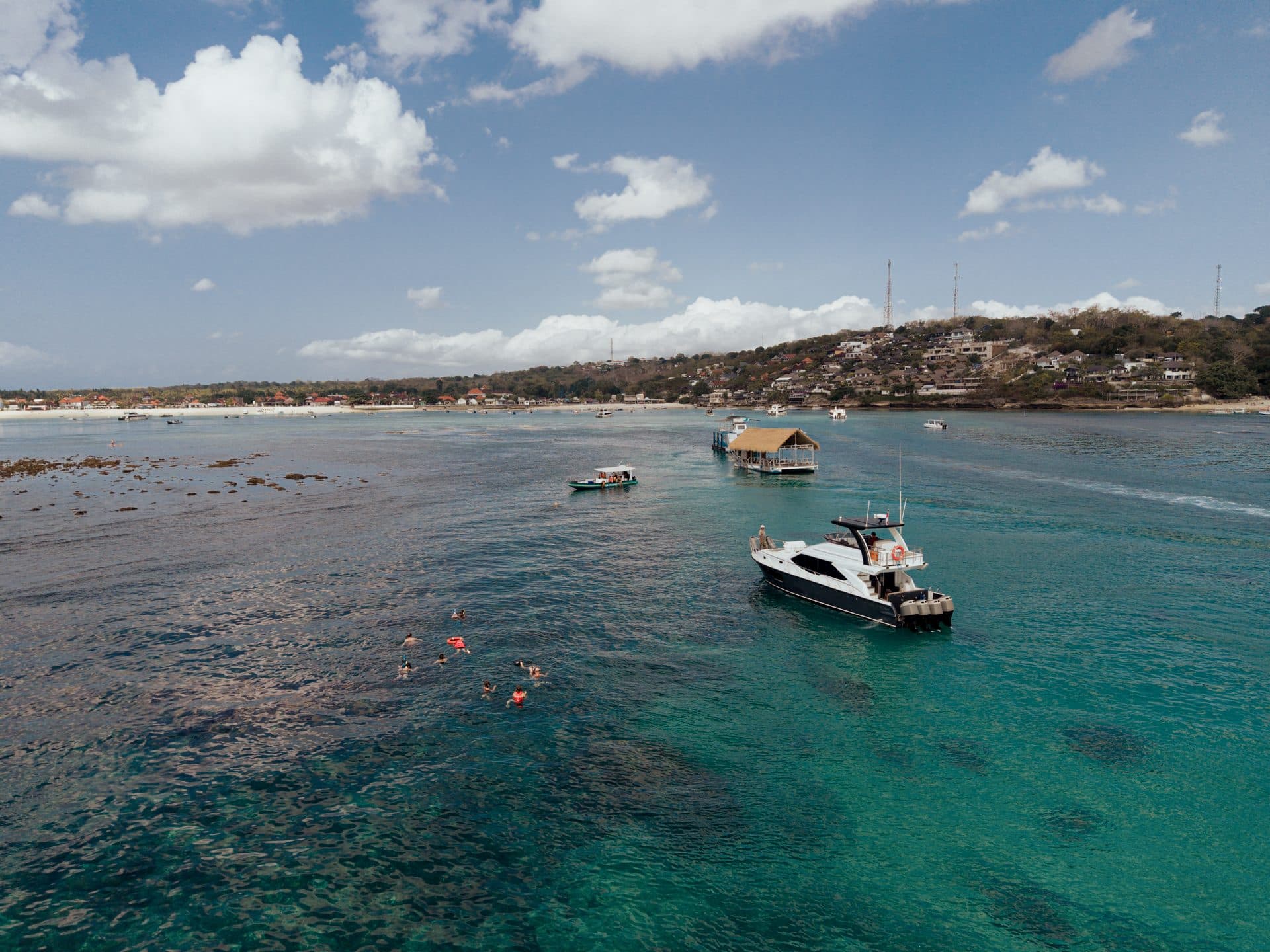 Azure Dream yacht in a turquoise Bali bay, aerial view