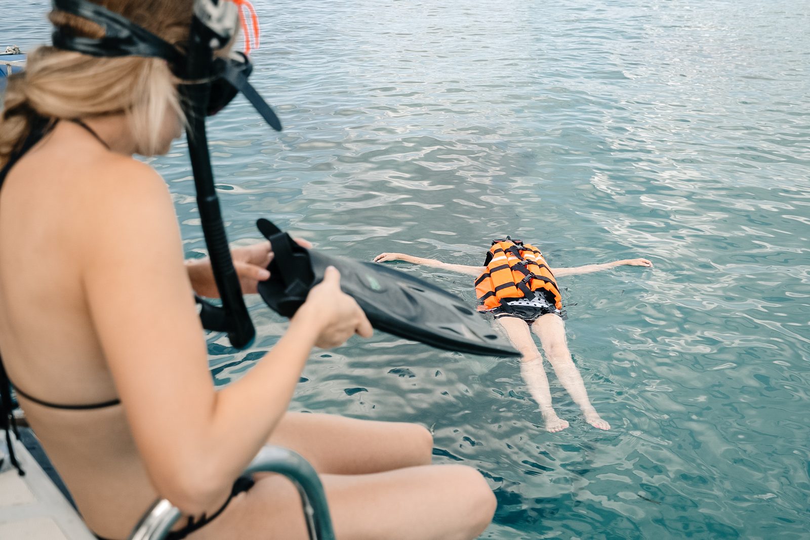 Guest preparing to snorkel aboard a private yacht in Bali